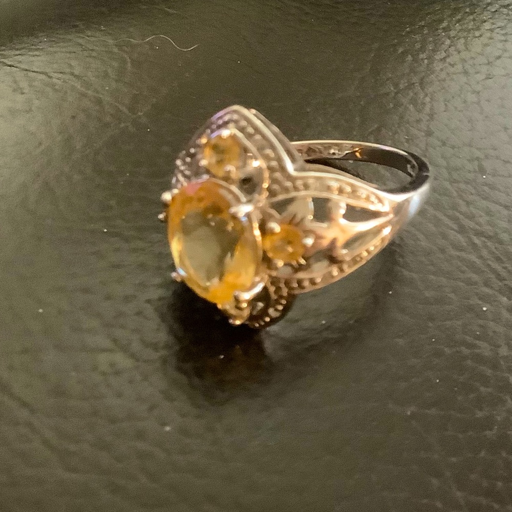 Silver Ring With Large Topaz Center Stone and Four Small Topaz Accent Stones